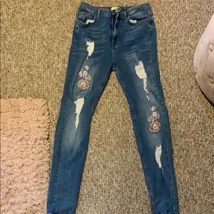 Distressed Light-washed blue jeans